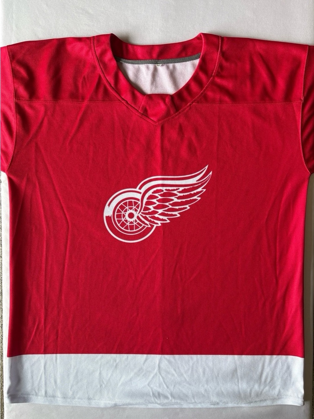 Detroit Men's Red Hockey Jersey with White Winged Wheel Graphic #71
